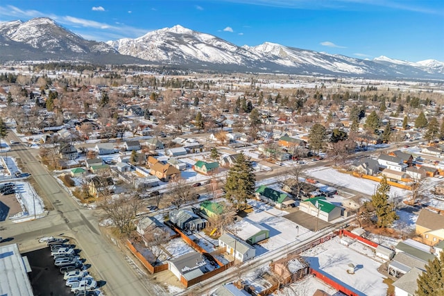 snowy aerial view with a mountain view