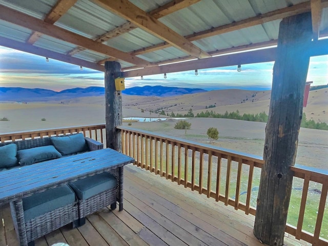 wooden terrace featuring a rural view