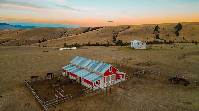 birds eye view of property featuring a rural view and a mountain view