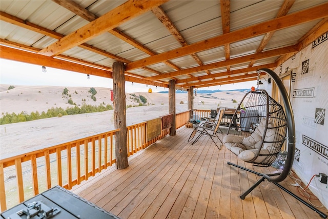 wooden deck featuring a mountain view