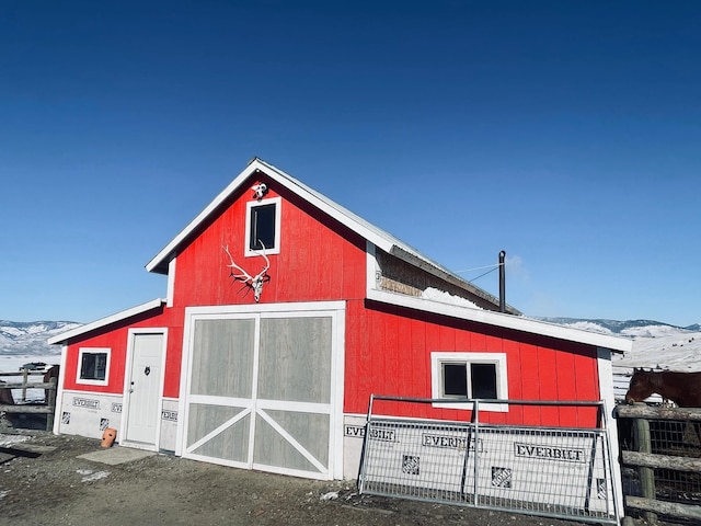 view of barn with a mountain view