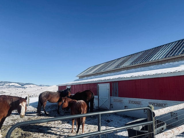 view of horse barn with a mountain view