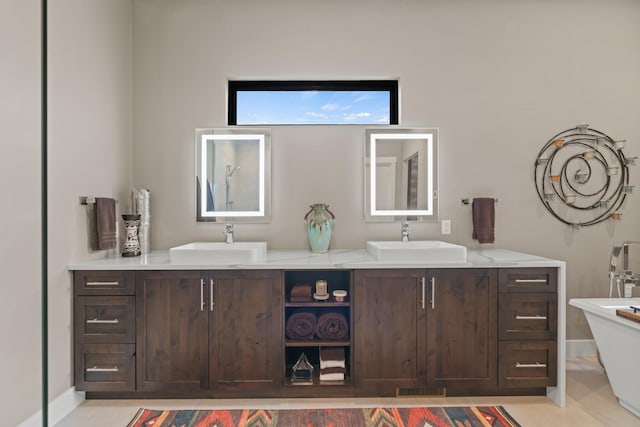 bathroom featuring a tub and vanity