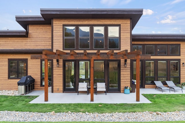 back of house with a patio area and a pergola