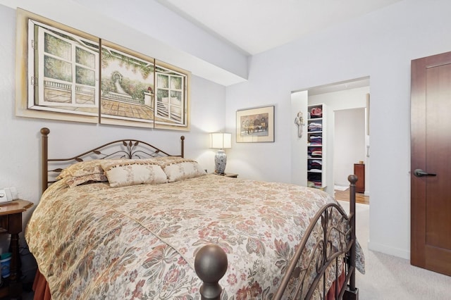 carpeted bedroom with a closet