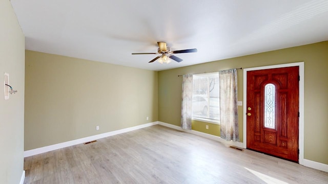 entryway with ceiling fan and light hardwood / wood-style flooring