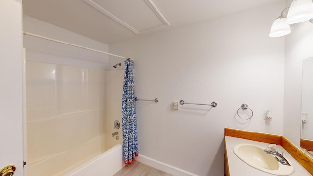 bathroom featuring shower / bath combo, hardwood / wood-style flooring, and vanity