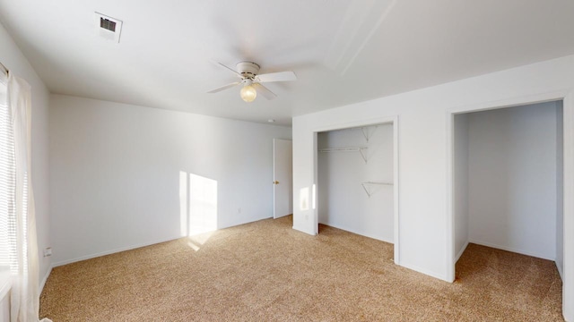 unfurnished bedroom with light carpet, ceiling fan, and a closet