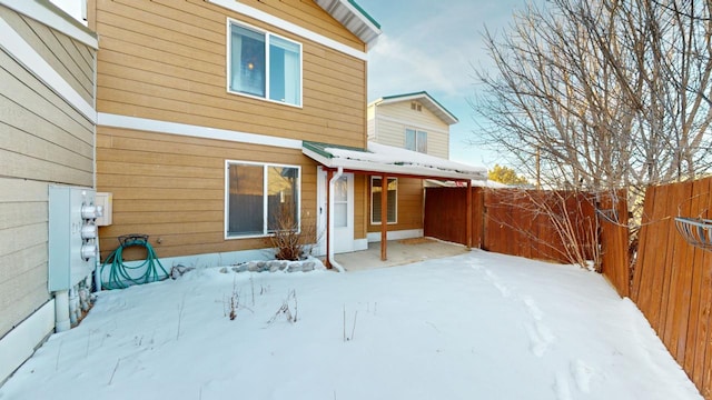 view of snow covered house