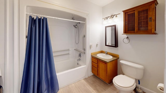 full bathroom with toilet, shower / tub combo, vanity, and hardwood / wood-style floors