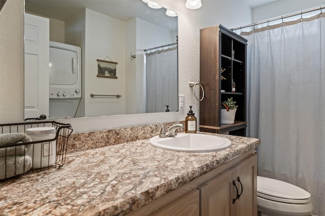 bathroom with stacked washer and dryer, toilet, a shower with curtain, and vanity