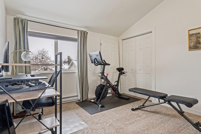 workout area featuring carpet and vaulted ceiling