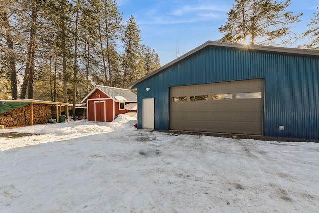 view of snow covered garage