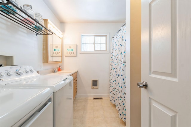 laundry room featuring separate washer and dryer and sink