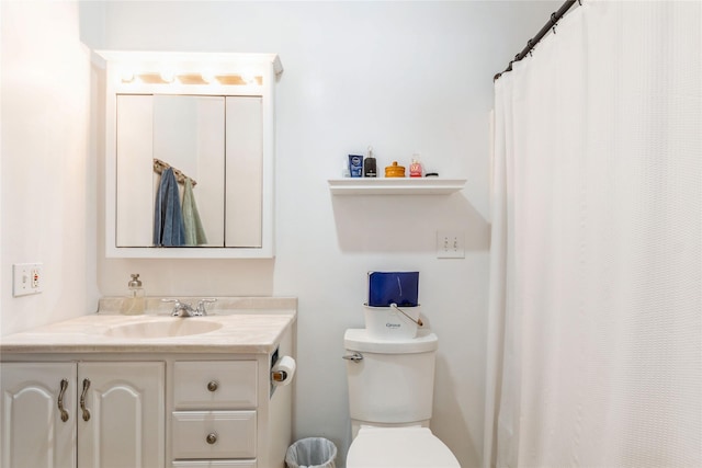 bathroom with toilet and vanity