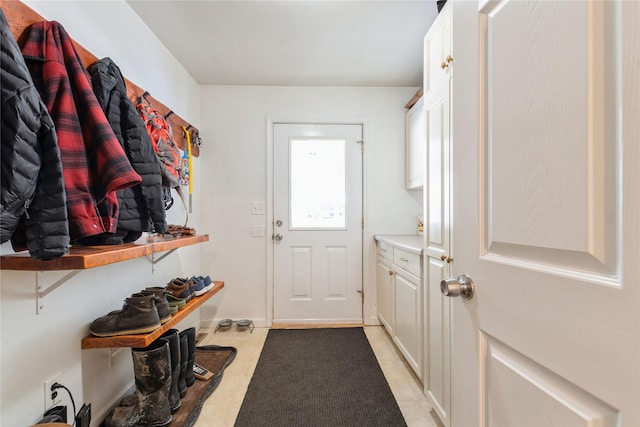mudroom with light tile patterned floors