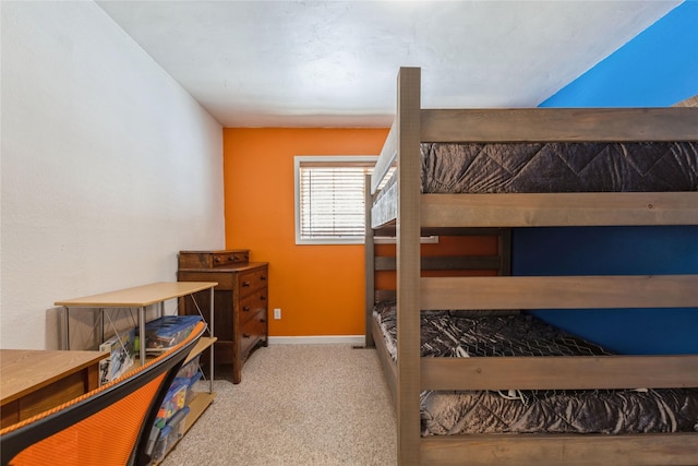 carpeted bedroom with baseboards