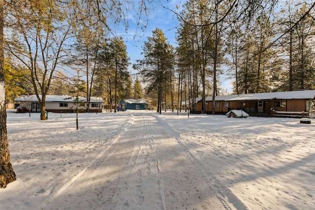 view of yard layered in snow