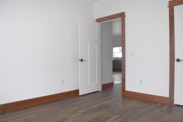 spare room featuring dark hardwood / wood-style flooring