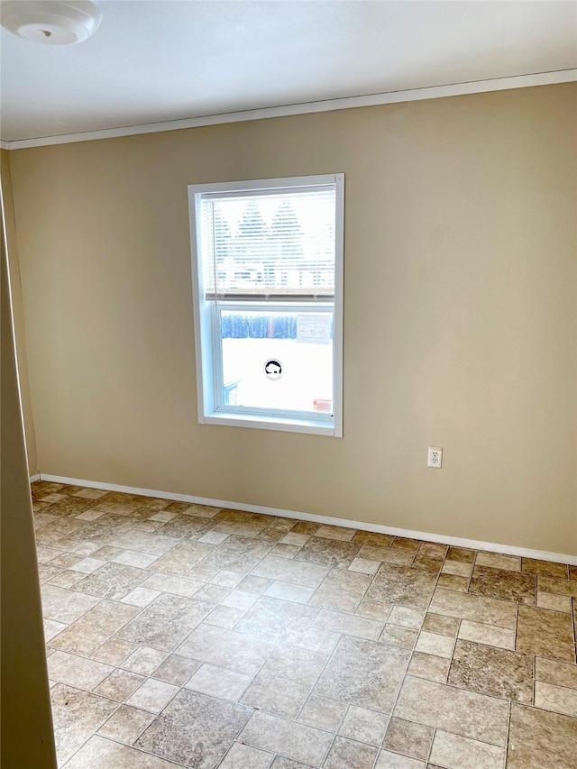 spare room with crown molding