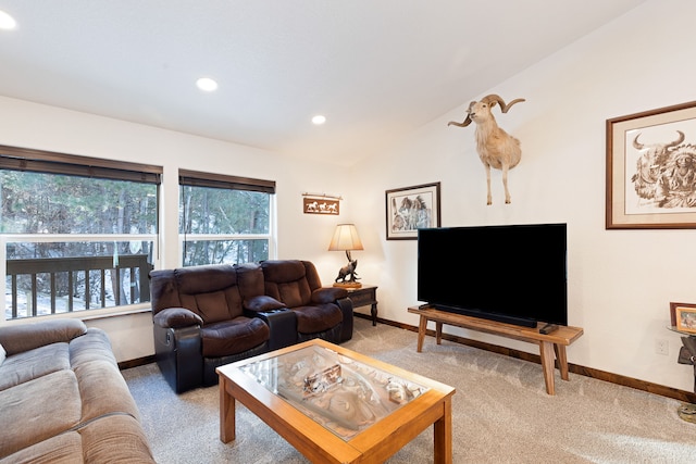 carpeted living room with vaulted ceiling