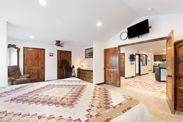 carpeted bedroom featuring ceiling fan and vaulted ceiling