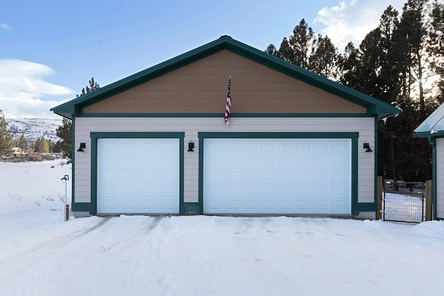 view of snow covered garage