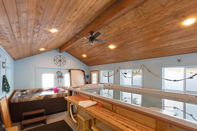 interior space featuring ceiling fan, a wealth of natural light, wood ceiling, and vaulted ceiling with beams