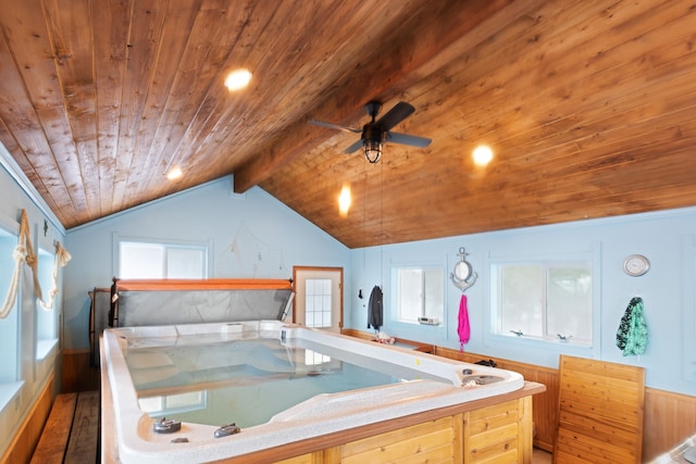 bathroom featuring vaulted ceiling, ceiling fan, wood ceiling, and wooden walls