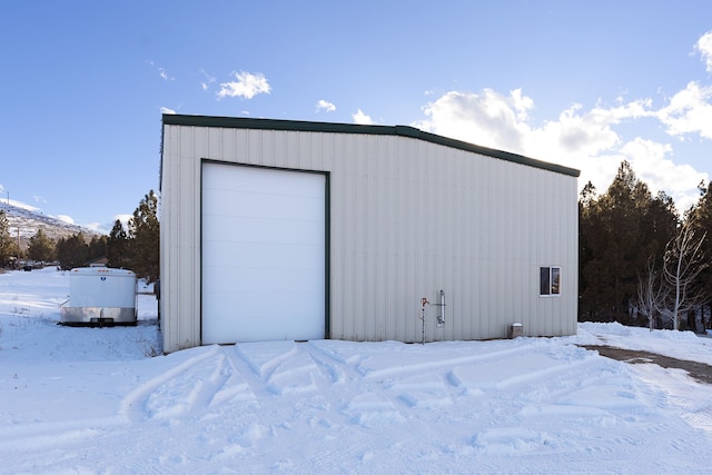 view of snow covered garage