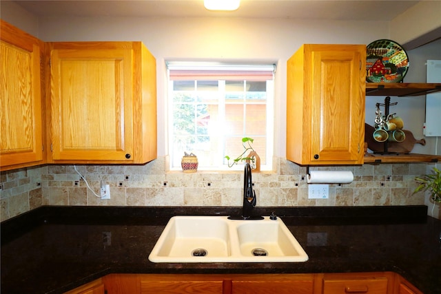 kitchen with decorative backsplash and sink