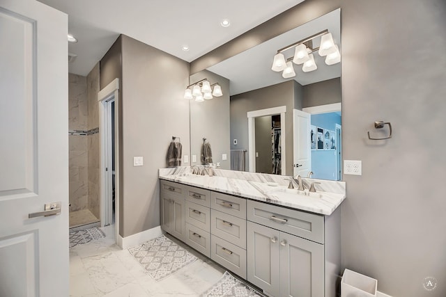 bathroom featuring vanity and a tile shower