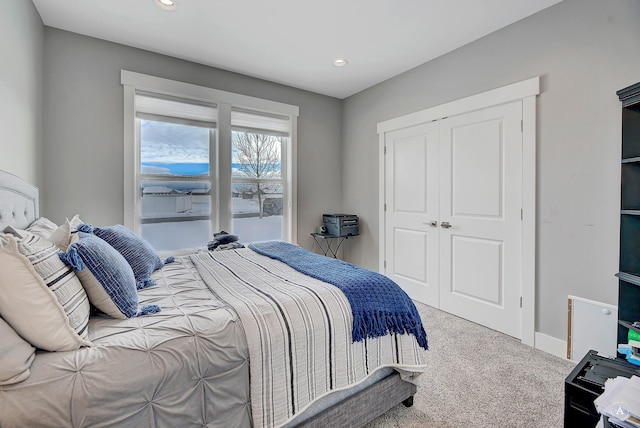 bedroom featuring a closet and carpet flooring