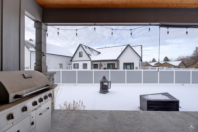 exterior space featuring an outdoor kitchen and grilling area