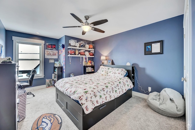 bedroom with ceiling fan and light colored carpet