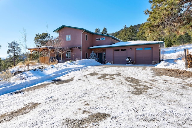 front of property with a garage