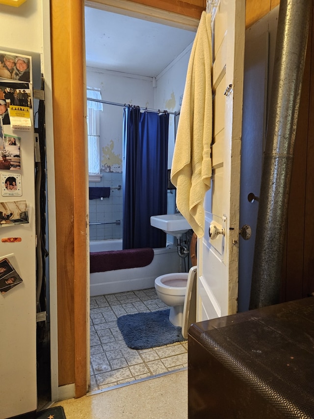 bathroom with toilet and shower / tub combo