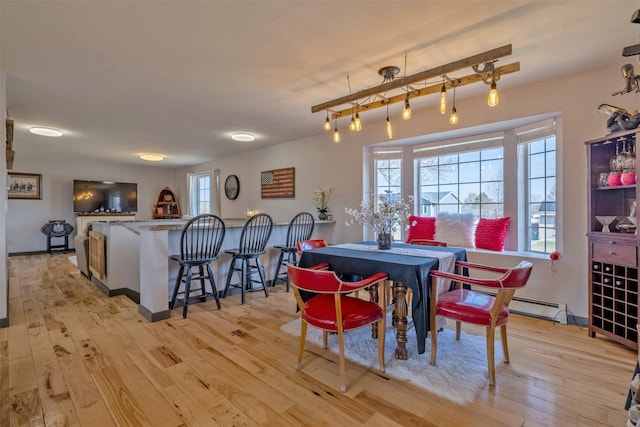 3761 Aster St, East Helena, MT 59635 - dining room with light wood-style floors and baseboard heating