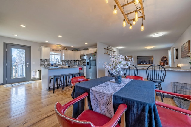 3761 Aster St, East Helena, MT 59635 - dining area featuring recessed lighting, a notable chandelier, and light wood-style floors