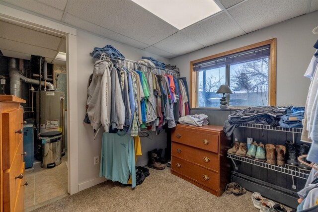 3761 Aster St, East Helena, MT 59635 - walk in closet with water heater, a drop ceiling, and carpet