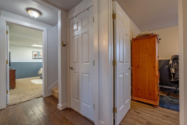 3761 Aster St, East Helena, MT 59635 - hallway featuring a wainscoted wall and wood finished floors