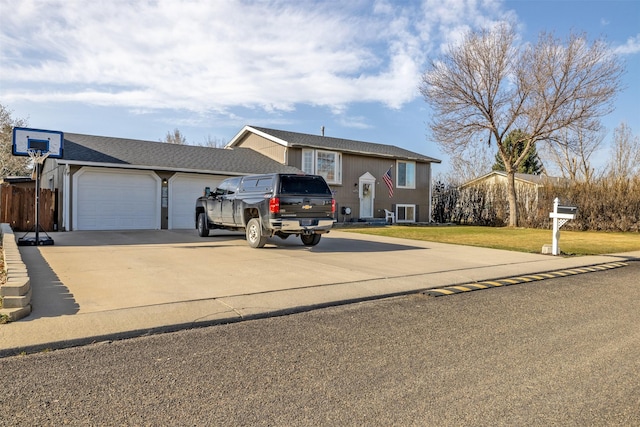 3761 Aster St, East Helena, MT 59635 - view of front of house featuring a garage, driveway, and a front lawn