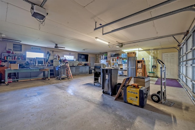 3761 Aster St, East Helena, MT 59635 - garage featuring a garage door opener and a workshop area