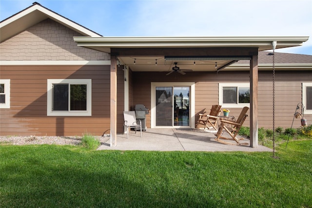 115 Stryker Peak Trl, Kalispell, MT 59901 - rear view of house with ceiling fan, a patio, and a lawn