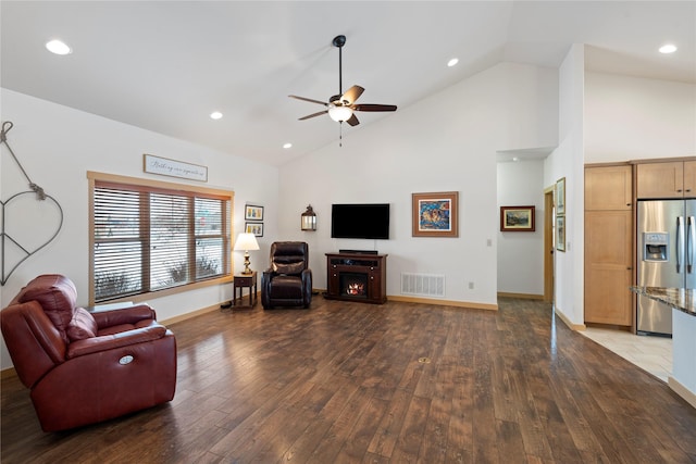 115 Stryker Peak Trl, Kalispell, MT 59901 - living room with wood-type flooring, a ceiling fan, baseboards, recessed lighting, and high vaulted ceiling