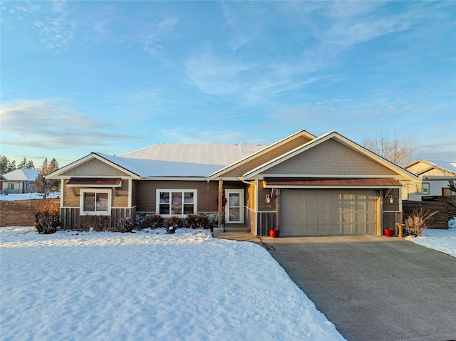 ranch-style house with a garage and driveway