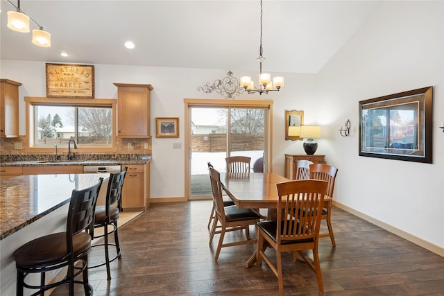 115 Stryker Peak Trl, Kalispell, MT 59901 - dining room featuring a chandelier, dark wood finished floors, recessed lighting, baseboards, and vaulted ceiling