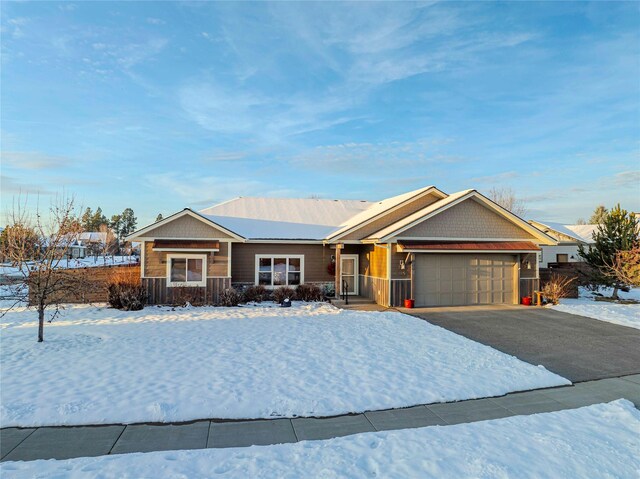 single story home featuring driveway and an attached garage