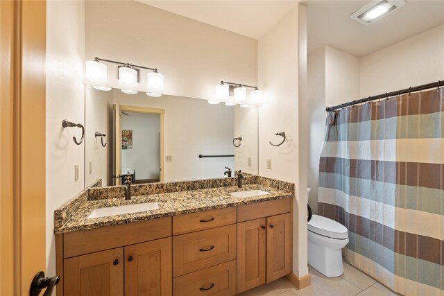 115 Stryker Peak Trl, Kalispell, MT 59901 - full bath featuring tile patterned flooring, toilet, double vanity, and a shower with curtain