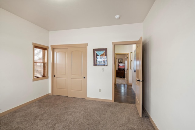 115 Stryker Peak Trl, Kalispell, MT 59901 - unfurnished bedroom with carpet, baseboards, and a closet
